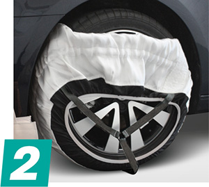 Fitting Snow Socks Stage 2 2: Pull as much of the sock over the tyre as possible.